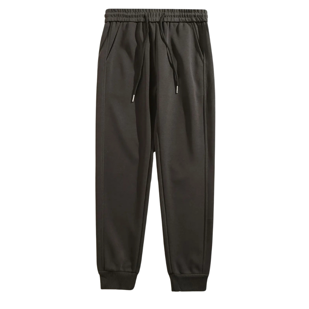 Calça moletom masculina em algodão premium, com design jogger, elástico na cintura e bolsos espaçosos. Ideal para conforto e estilo moderno.
