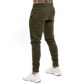 Calça de moletom fitness masculina, confeccionada em algodão premium, com bolsos com zíper e cintura ajustável. Perfeita para treinos e conforto diário.