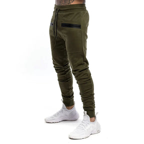 Calça de moletom fitness masculina, confeccionada em algodão premium, com bolsos com zíper e cintura ajustável. Perfeita para treinos e conforto diário.