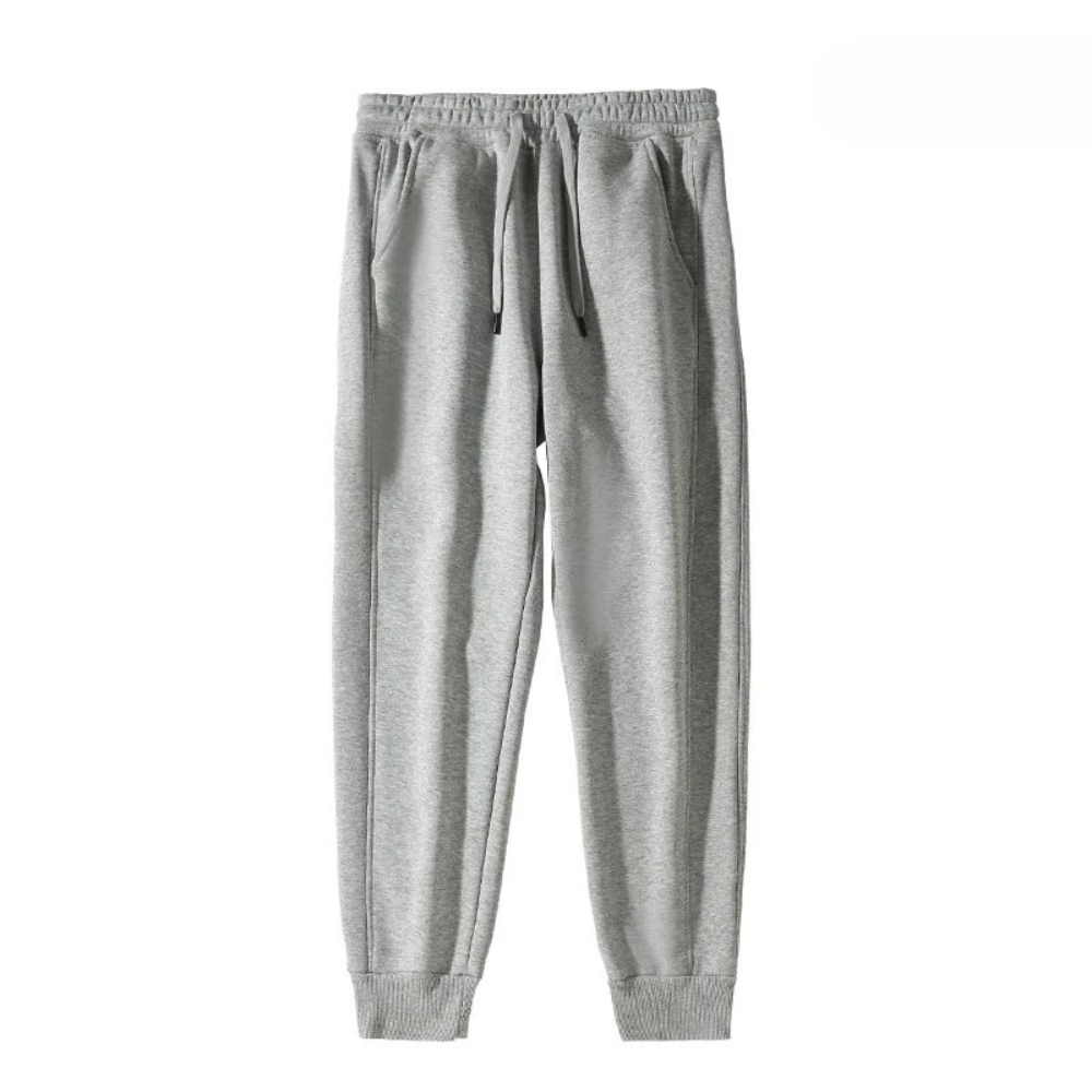 Calça moletom masculina feita em algodão premium, com bolsos, ajuste solto e cintura elástica. Ideal para praticidade e conforto no dia a dia.