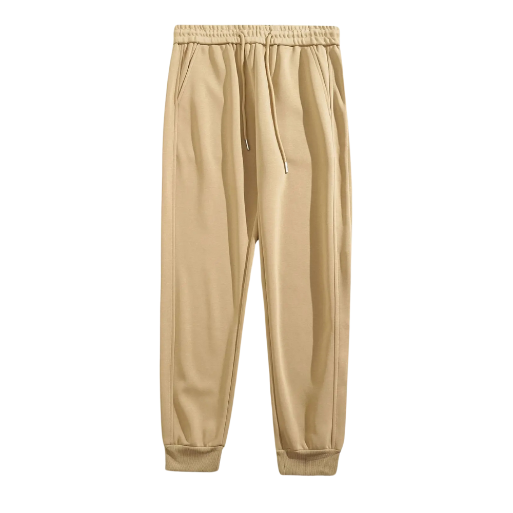 Calça moletom masculina em algodão premium, com design jogger, elástico na cintura e bolsos espaçosos. Ideal para conforto e estilo moderno.