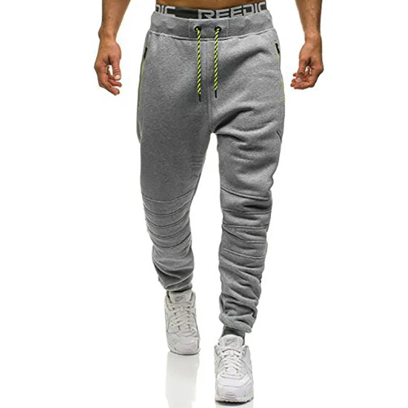 Calça Moletom Masculina para Esportes RZ316 em algodão premium, com zíper nos bolsos e design ajustável. Perfeita para treinos e estilo no dia a dia.