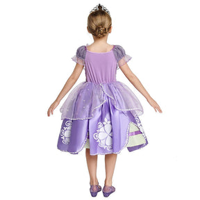 Fantasia Infantil Vestido Princesa Lilás Encantada com vestido, coroa, luvas e varinha, feita em algodão e poliéster, ideal para festas infantis.